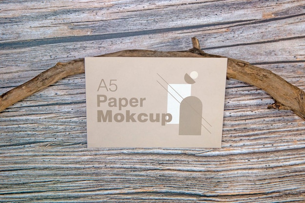 A5 paper greeting card mockup on wooden background