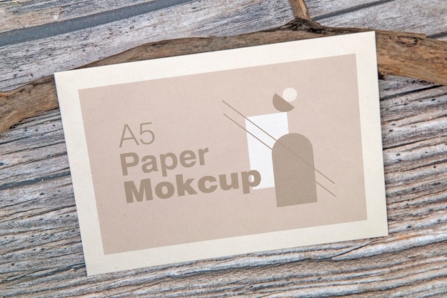 A5 paper greeting card mockup on wooden background