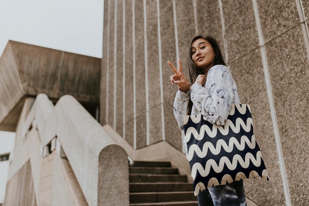 accessory apparel mockup tote bag psd young woman on a staircase