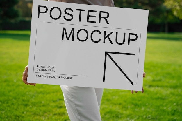 Adult holding poster