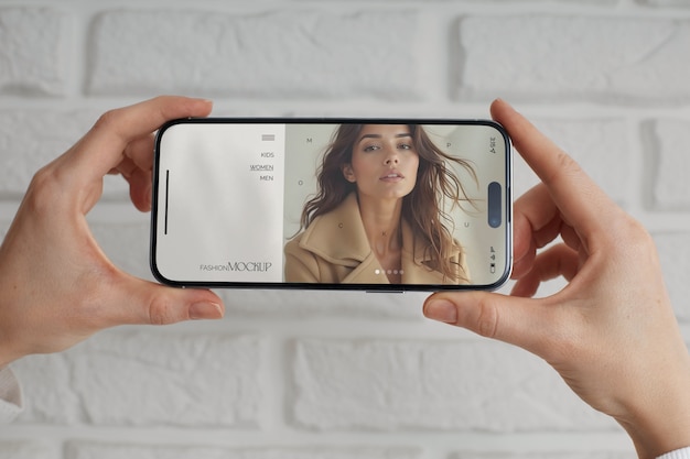 Adult holding smartphone mockup