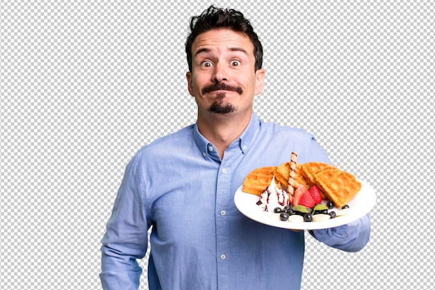 Adult man having waffles for breakfast