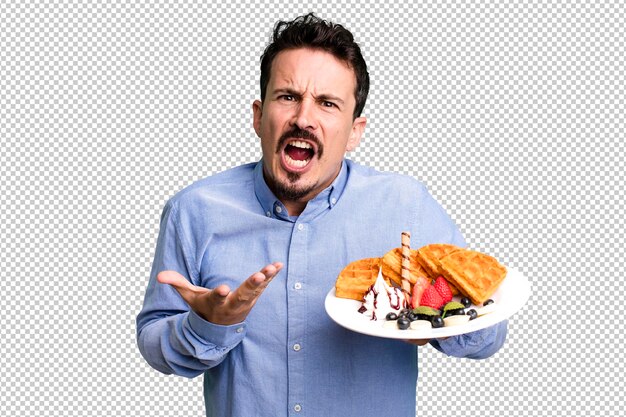 Adult man having waffles for breakfast