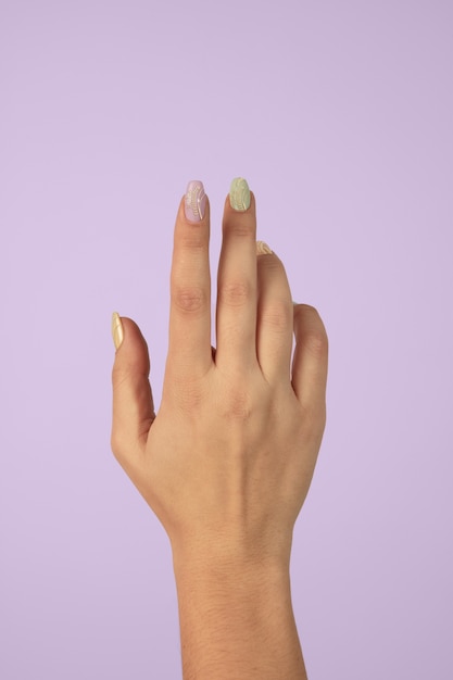 Adult woman hand with nail polish