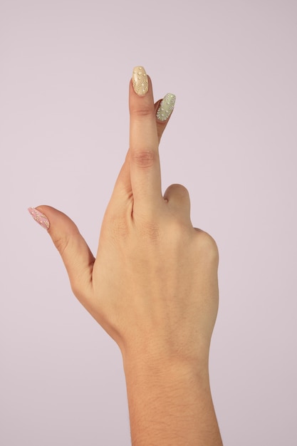 Adult woman hand with nail polish