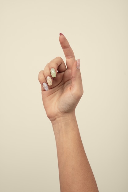 adult woman hand with nail polish