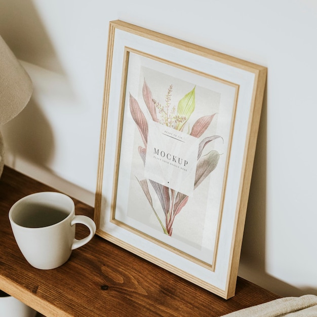 aesthetic picture frame mockup psd on wooden shelf home decor