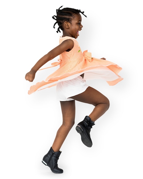 PSD african little girl playful dancing studio portrait