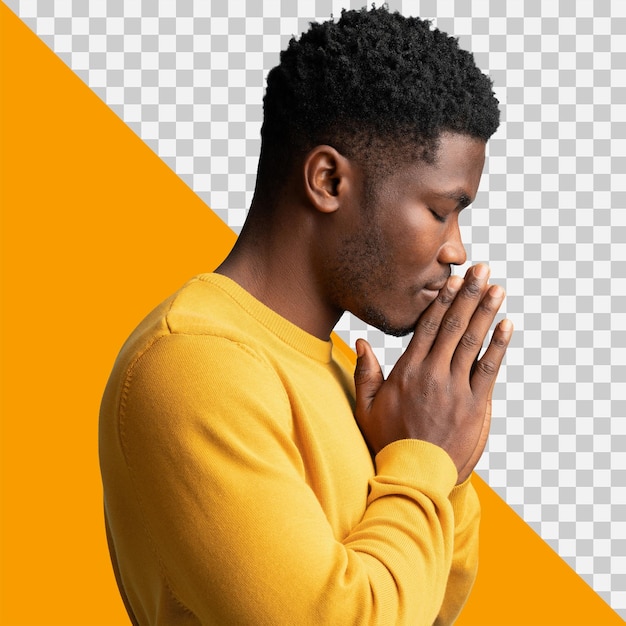 PSD 노란 스웨터 를 입은 아프리카 사람 이 기도 하고 있다