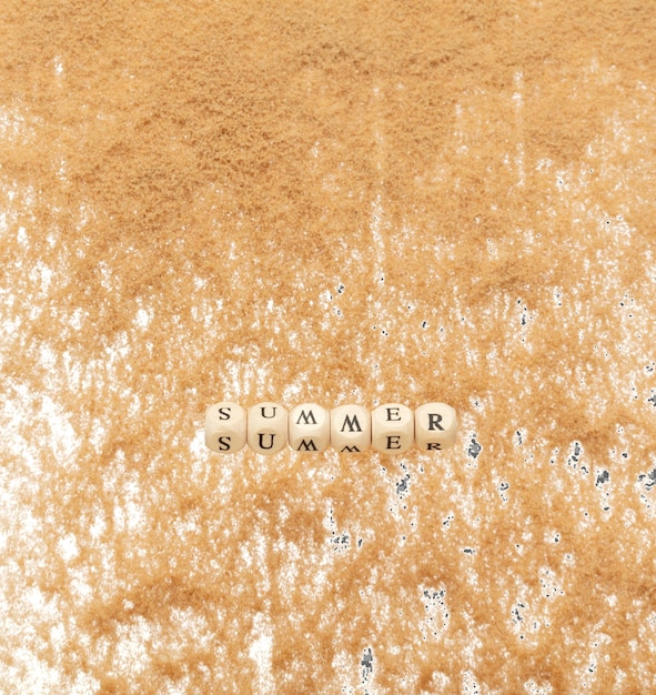 PSD alphabet letter wording summer bead toy flying over sand explosion flying in air summer word alphabet letter show tropical island beach sand for vacation holiday white background isolated