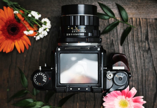 PSD analog camera screen mockup surrounded by flowers