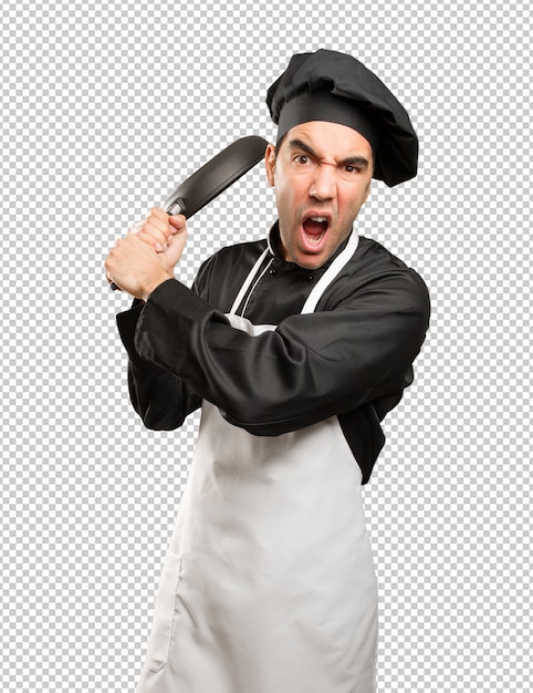 PSD angry young chef using a cooking utensil