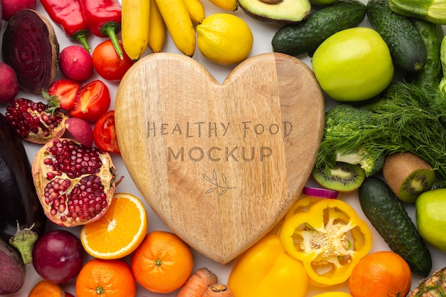 arrangement of delicious vegetables and fruits with mock-up wooden board