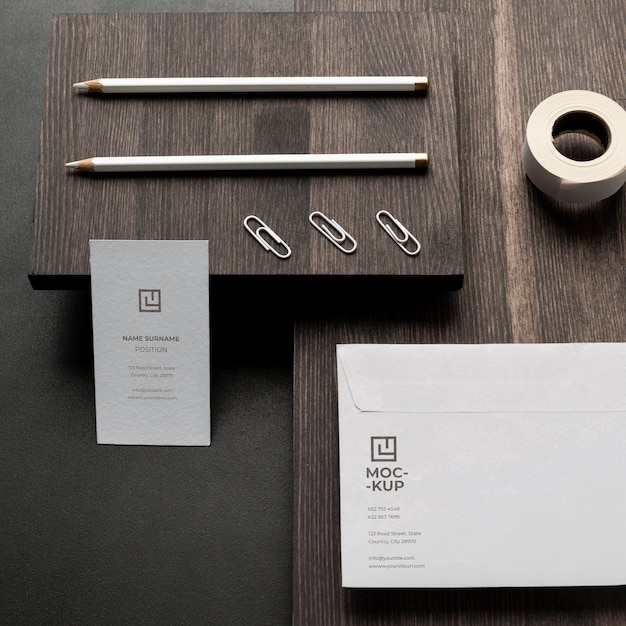 arrangement of mock-up stationery on wood