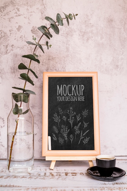 arrangement with plant and blackboard