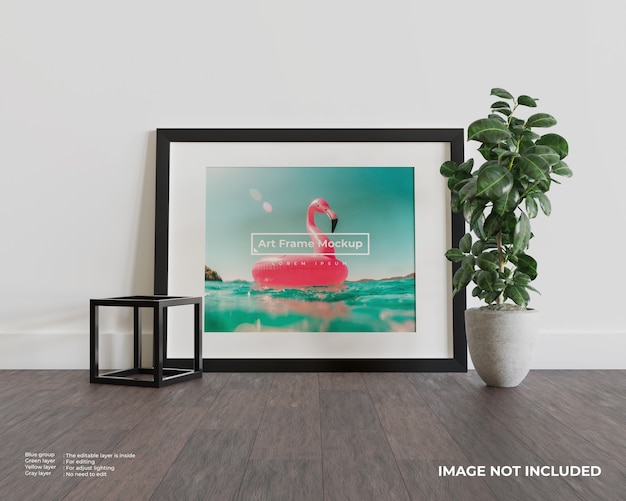 Art frame mockup on dark wood floor