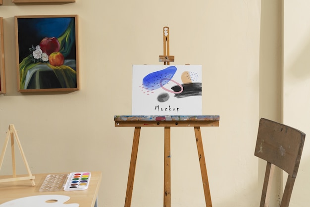 PSD art studio with easel mockup design