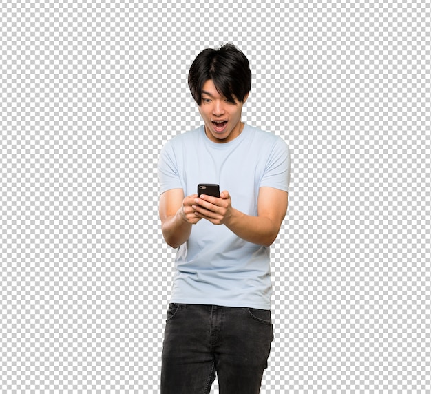 Asian man with blue shirt surprised and sending a message