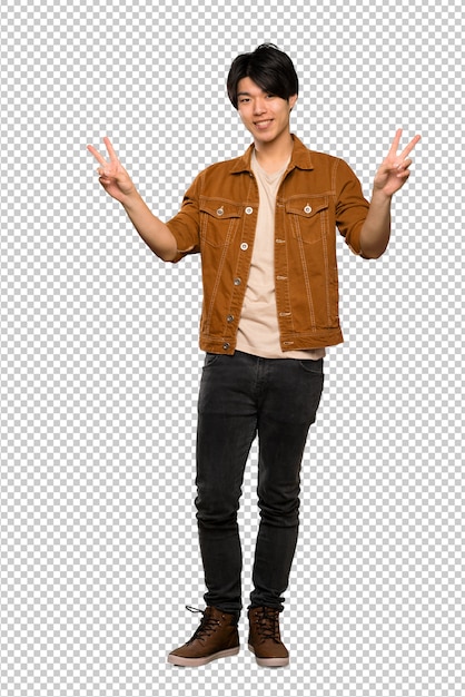 Asian man with brown jacket showing victory sign with both hands