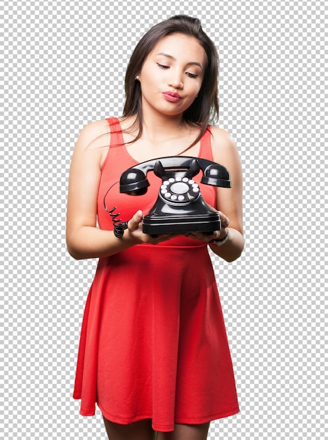 Asian woman holding a telephone