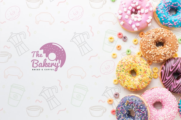 PSD assortment of colorful donuts with mock-up