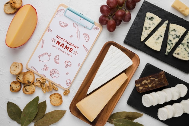 PSD assortment of delicious foods with clipboard mock-up