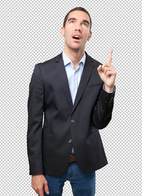 Astonished businessman pointing up