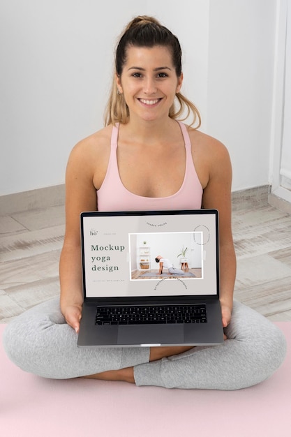 Athletic woman doing yoga at home