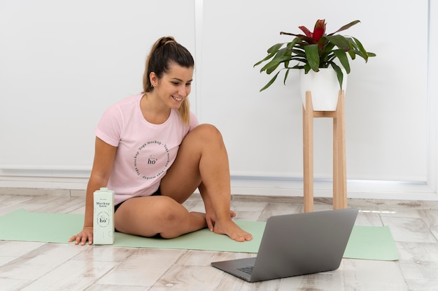 Athletic woman doing yoga at home