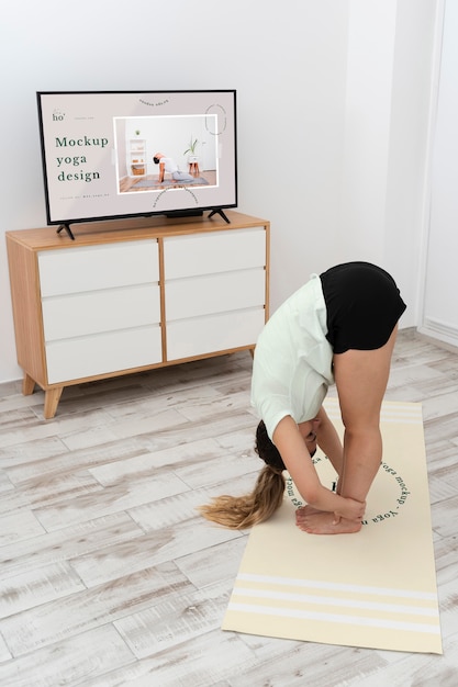 PSD athletic woman doing yoga at home