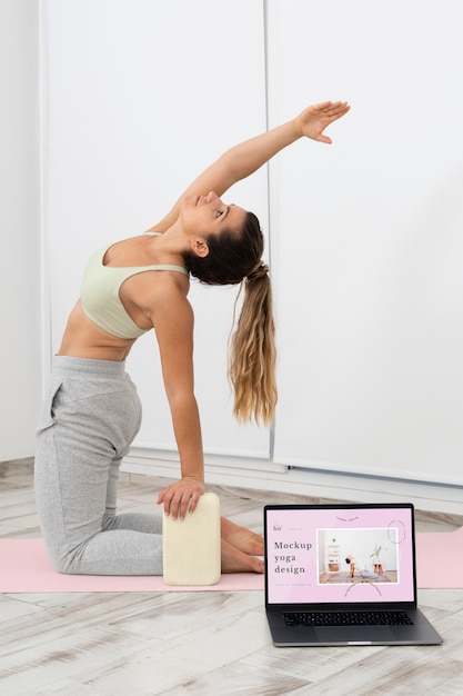 PSD athletic woman doing yoga at home