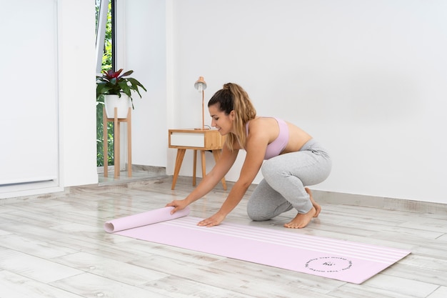 PSD athletic woman doing yoga at home