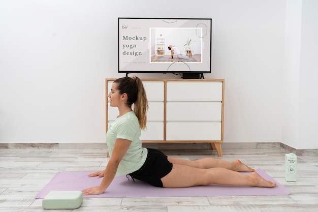 PSD athletic woman doing yoga at home