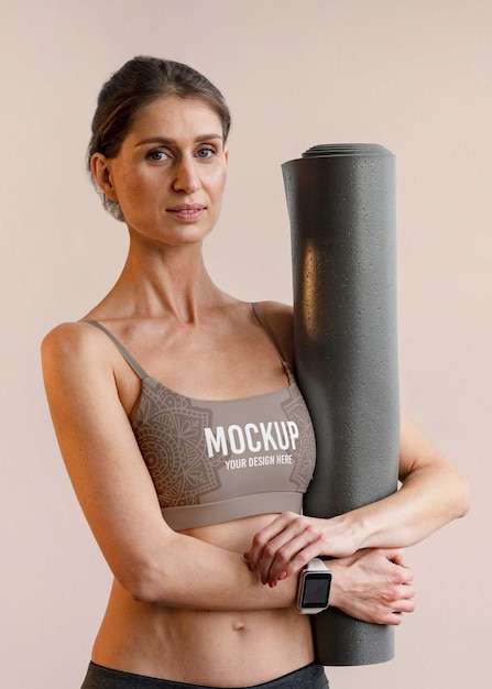 PSD athletic woman holding yoga mat