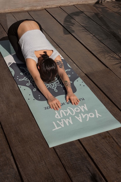 Athletic woman with yoga mat mock-up design