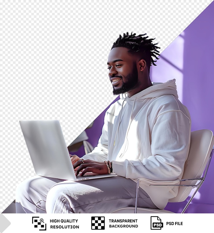 PSD awesome joyful mood elegant young adult man working on laptop smiling looking at screen sitting on chair in sunlit room png