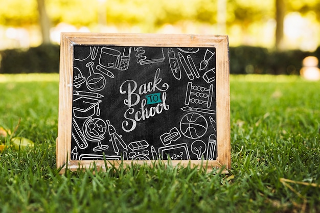 Back to school blackboard on grass mock-up