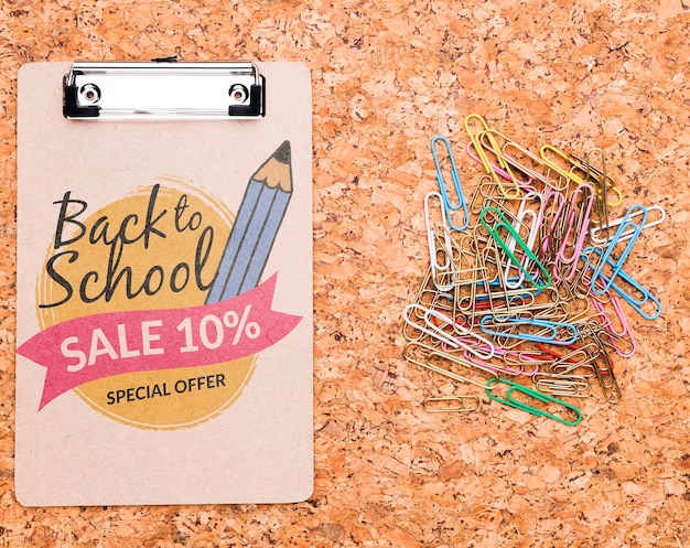 PSD back to school clipboard next to colorful clips mock-up