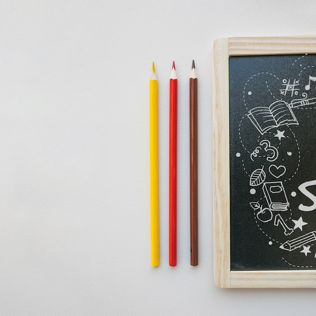 PSD back to school mockup with slate next to pencils