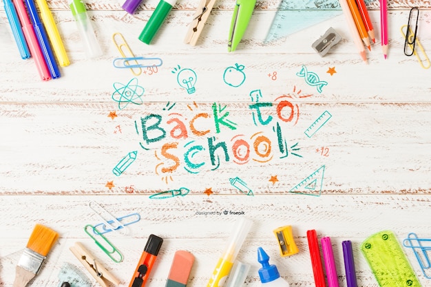 Back to school supplies on wooden background