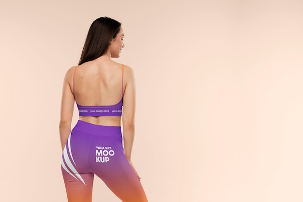 Back view woman wearing yoga leggings