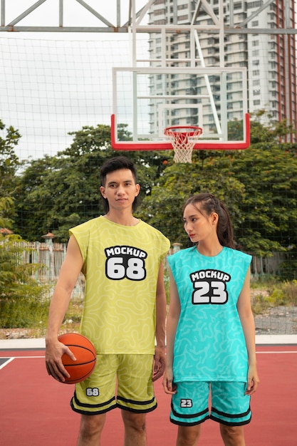 Basketball player wearing jersey mock-up design outdoors on the court