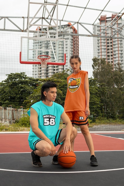 PSD basketball player wearing jersey mock-up design outdoors on the court