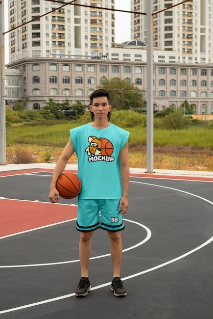 Basketball player wearing jersey mock-up design outdoors on the court