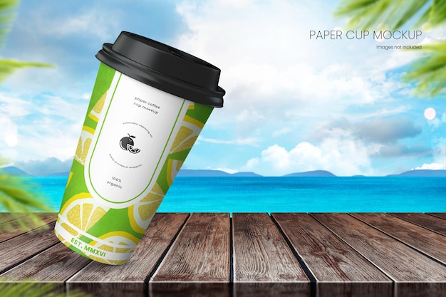 Beach paper cup mockup on rustic wooden tabletop with blue sky