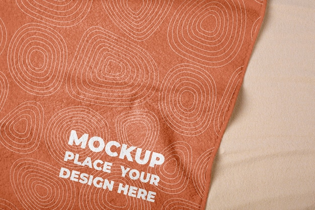 PSD beach towel mock-up with sand