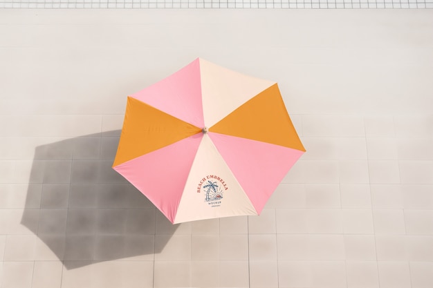 PSD beach umbrella mockup by seaside