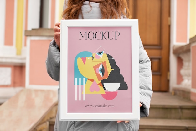 Beautiful frame model mockup held by girl