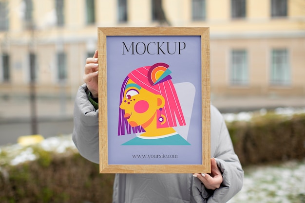 Beautiful frame model mockup held by girl