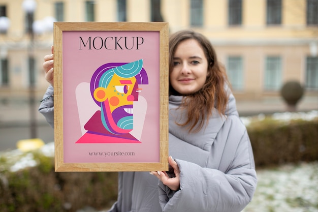 Beautiful frame model mockup held by girl